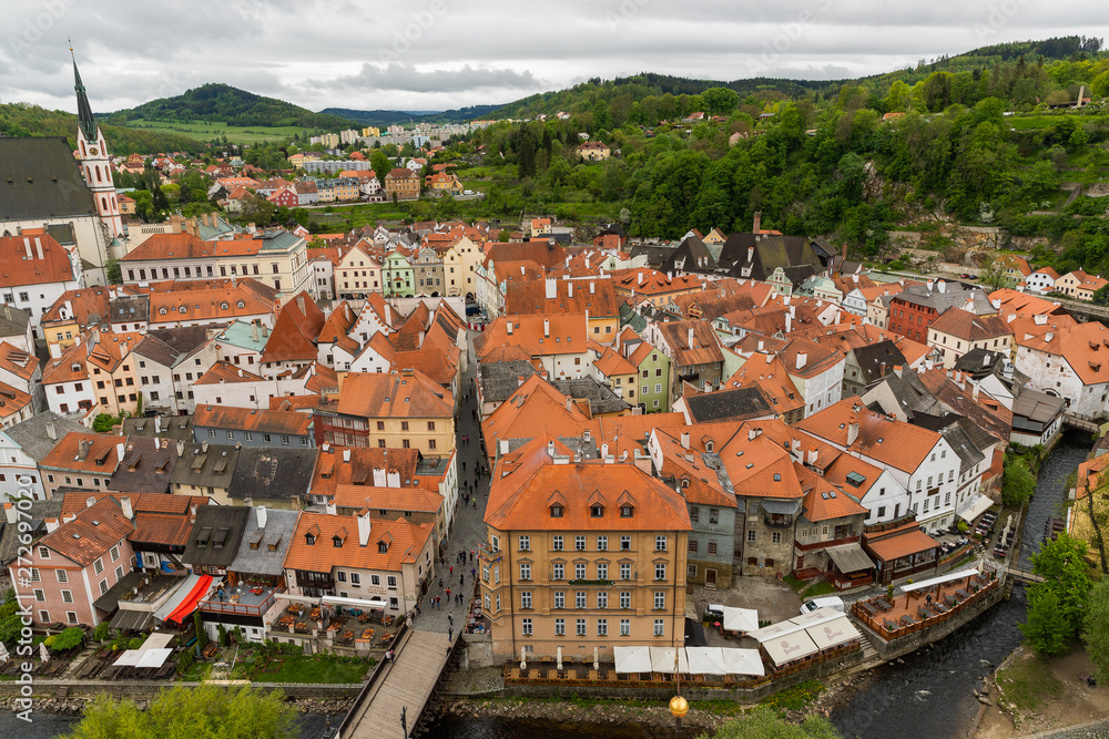 Panoramic landscape view above from aerial of the historic city of Cesky Krumlov with famous Cesky Krumlov Castle, Church city is on a UNESCO World Heritage Site captured during the spring