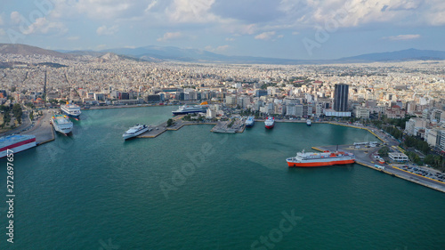 Aerial panoramic view of famous port of Piraeus one of the largest and busiest in Mediterranean sea where passenger ships travel to Aegean destinations, Attica, Greece © aerial-drone
