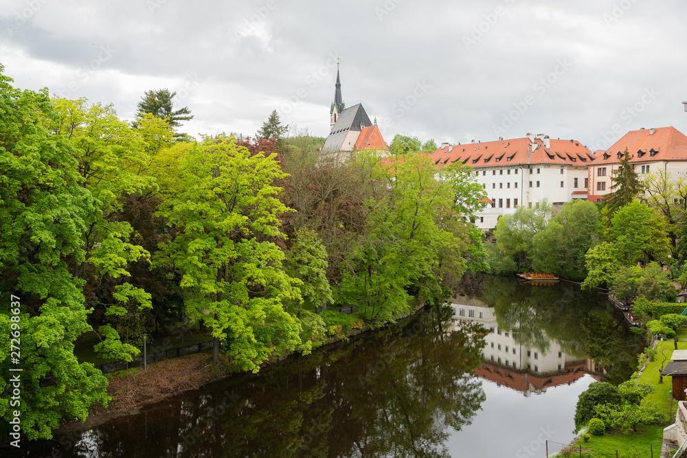 View of the Vltava River flowing through the town of Cesky Krumlov with the famous Cesky Krumlov Castle, Church of the World Heritage Site.