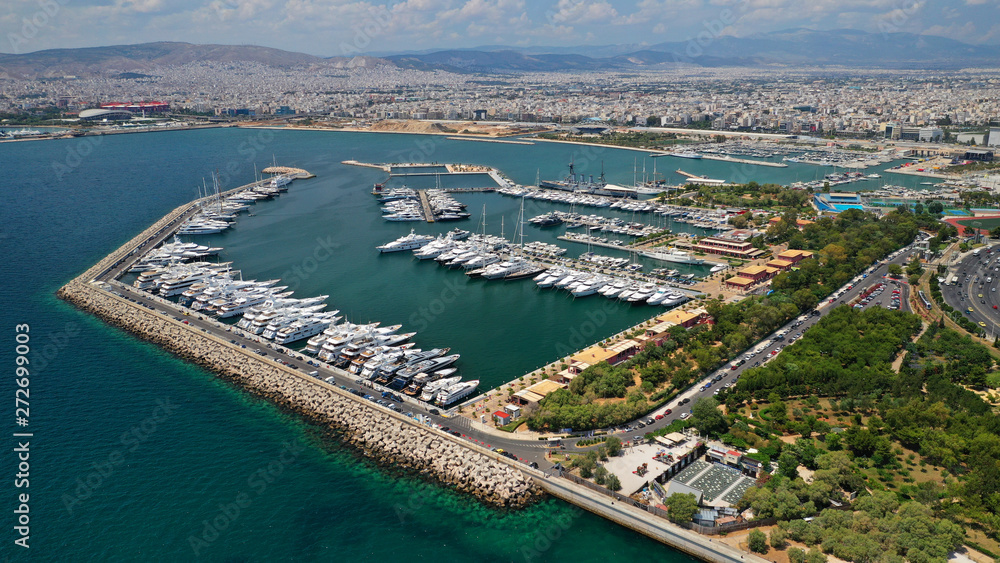 Aerial panoramic photo of famous seaside bay of Faliro with beautiful emerald sea, clouds and deep blue sky