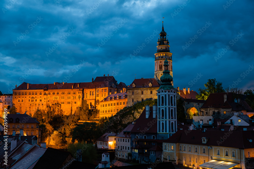 Panoramic landscape sunset view with blue dark sky the historic city of Cesky Krumlov with famous Church city is on a UNESCO World Heritage Site captured during spring with nice sky and clouds