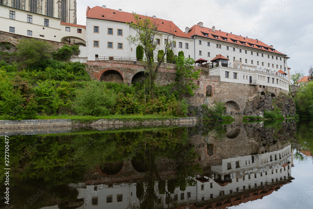View of the Vltava River and the Church with the Reflection of the Cesky Krumlov River with the Famous Cesky Krumlov Castle, the UNESCO World Heritage Site