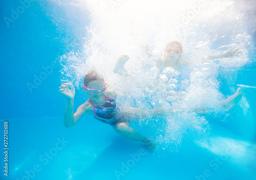 Children swim in pool