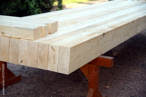 Natural Wooden beams for outdoor construction on working trestle. wood construction beams. Bar for construction. 