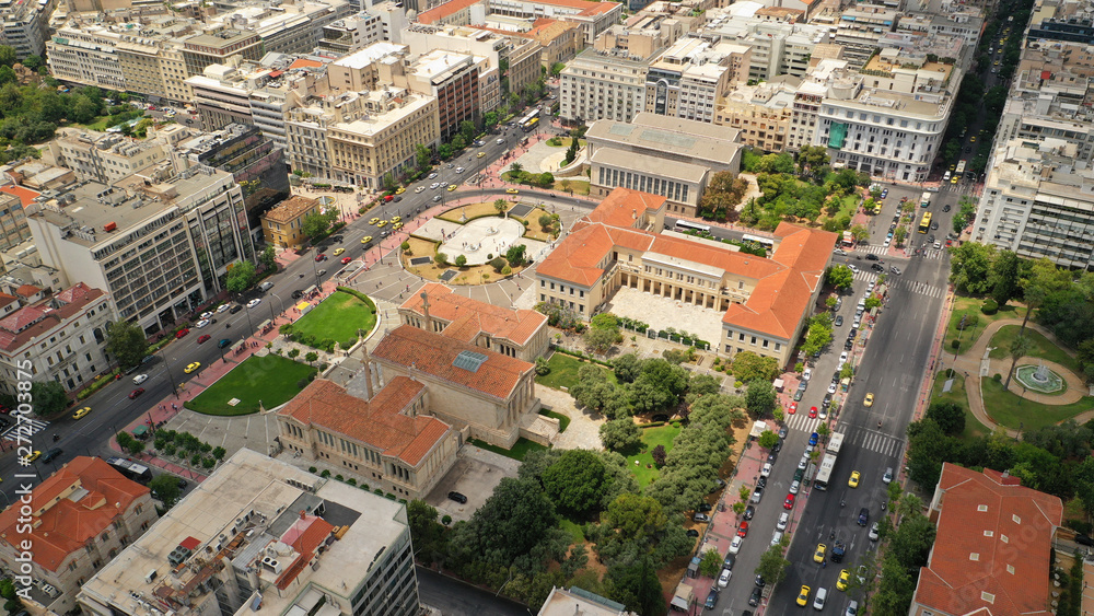 Aerial photo of famous landmark buildings of Academy of Athens, Panepistimio and public Library, Athens, Attica, Greece