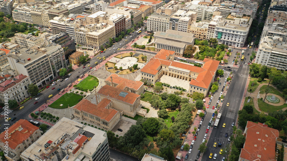 Fototapeta premium Aerial photo of famous landmark buildings of Academy of Athens, Panepistimio and public Library, Athens, Attica, Greece