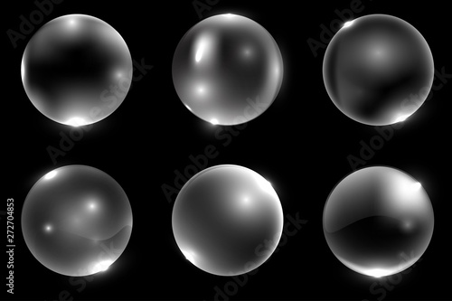Set of realistic 3d glass ball or sphere isolated on black background. Vector illustration.