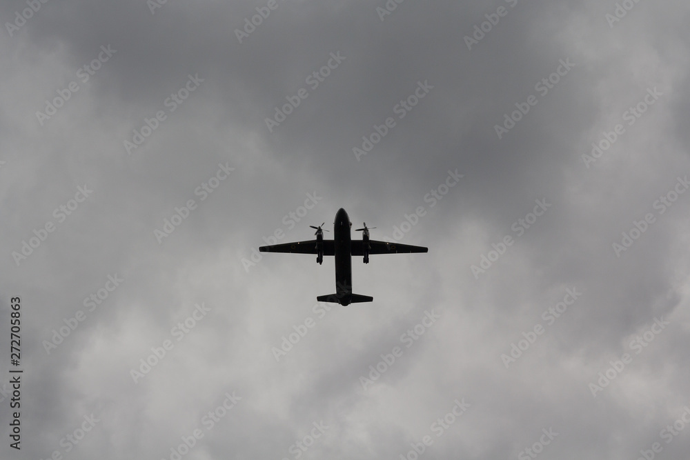 Silhouette of airplane during bad weather. Transport Silhouette of airplane during bad weather. Transport