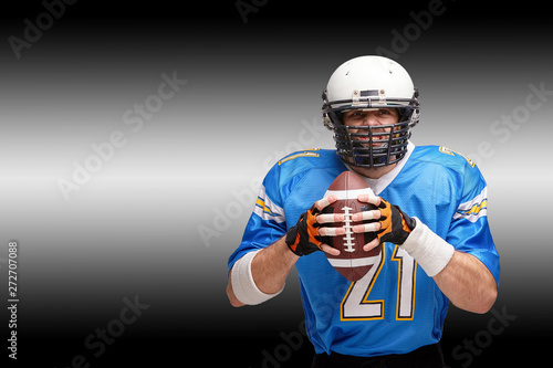 Concept american football, portrait of american football player in helmet with patriotic look. Black white background, copy space.