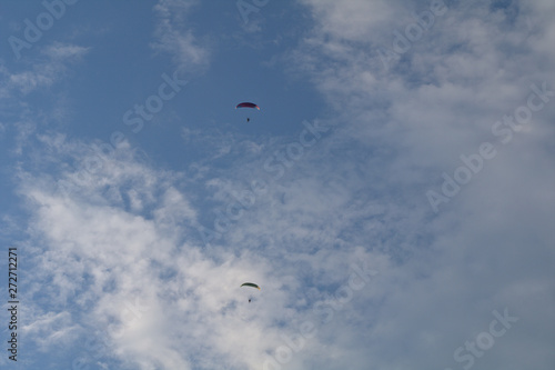 kite flying in the sky,motorized,paraglider,sport, blue, fly,adventure, cloud,sports, glider, wind, high,  