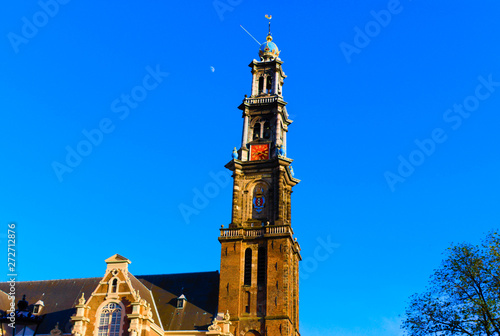 wester church amsterdam daytime with the moon in the background photo