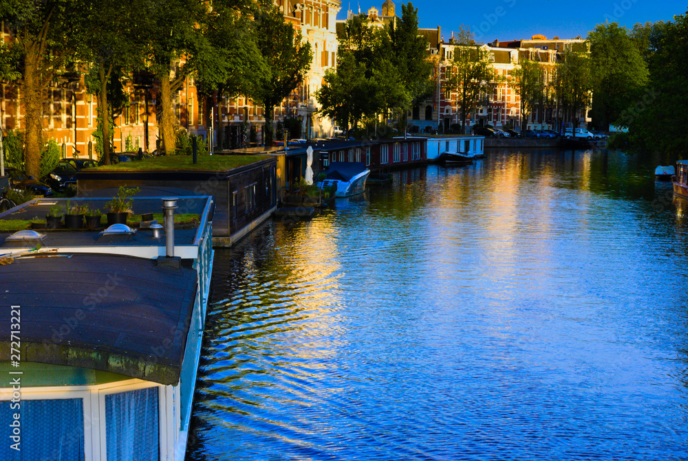 sunset over the canals of amsterdam