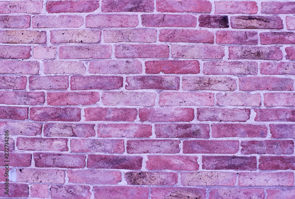 Lilac old brickwork. A snapshot of the wall of an old brick building.