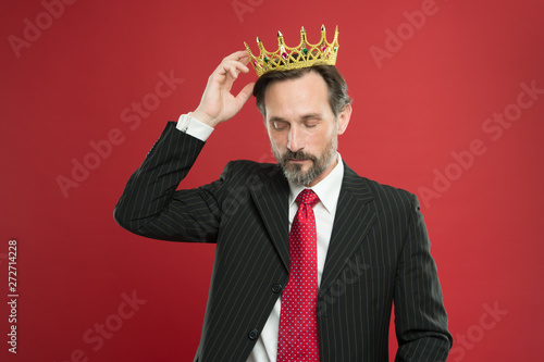 Living life like big boss. Big boss wearing jewelry crown on red background. Powerful big boss with crowned head in formalwear. Mature businessman or big boss photo