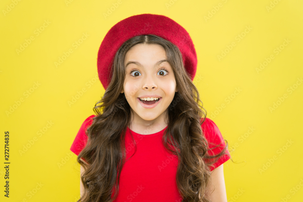Perfect curls. Kid cute face with adorable curly hairstyle wear beret hat. Little fashionista. Little girl grow long hair. Styling of curly hair. Hairdresser service. Kid girl long healthy shiny hair Perfect curls. Kid cute face with adorable curly hairstyle wear beret hat. Little fashionista. Little girl grow long hair. Styling of curly hair. Hairdresser service. Kid girl long healthy shiny hair