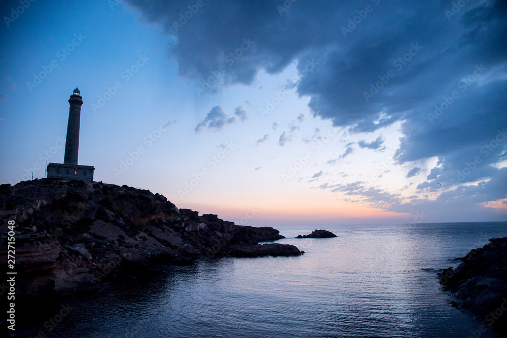  Maritime landscape at sunrise in the Mediterranean Sea with the lighthouse on