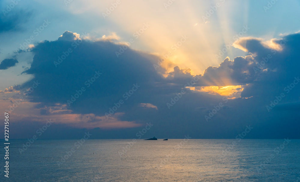  Maritime landscape at sunrise in the Mediterranean Sea with the lighthouse on