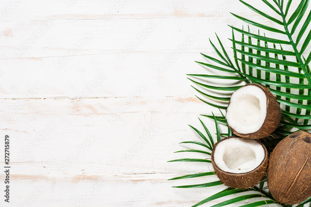 Palm leaves and coconut on whitee top view. Palm leaves and coconut on whitee top view.