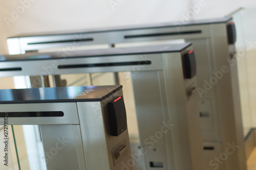 Tablou pe pânză Automatic security turnstiles with card reader in a corporate office building