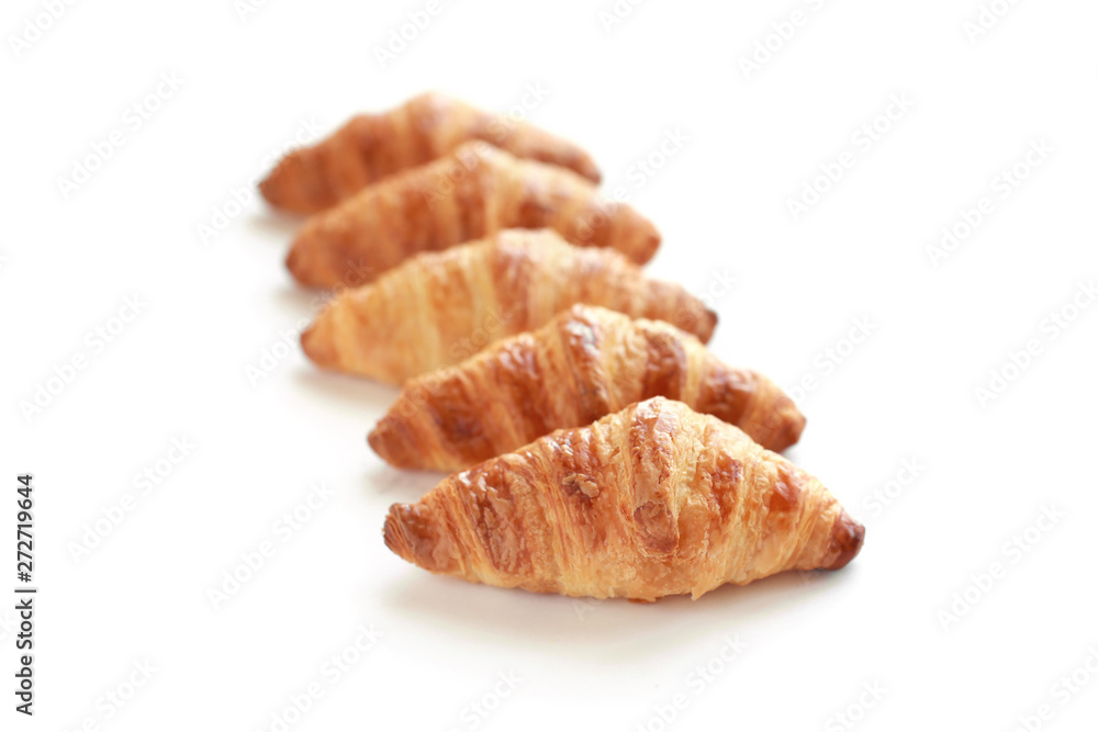 Freshly baked tasty croissants isolated on white. Freshly baked tasty croissants isolated on white.