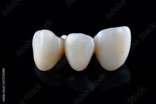beautiful dental crowns of a natural look on a black background