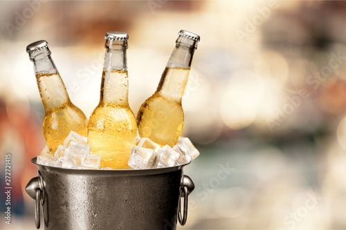 Bottles of cold and fresh beer photo