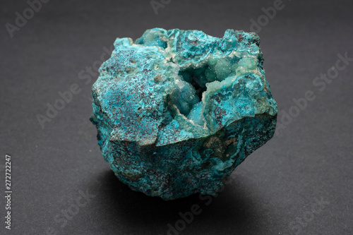 Piece of Chrysocolla mineral from Peru with quartz and gypsum, blue turquoise crystals. Chrysocolla is a hydrated copper phyllosilicate mineral. photo