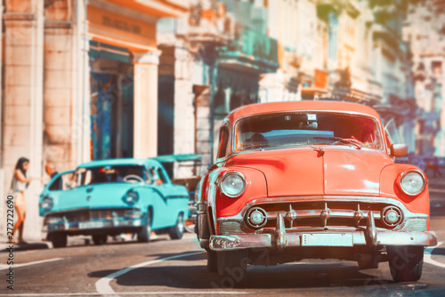 Urban scene with antique cars in Havana © kmiragaya