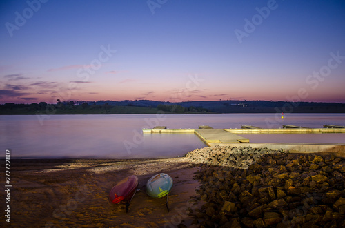 Background image landscape photography of Kaiak boat at the pier and beach in the beautiful and peaceful afternoon