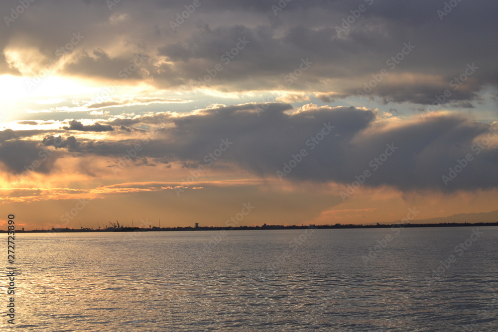 Beautiful sunset and clouds over the lagoon in the area of Venice.