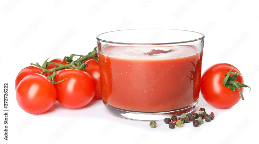 Glass of sauce, tomatoes and pepper isolated on white Glass of sauce, tomatoes and pepper isolated on white