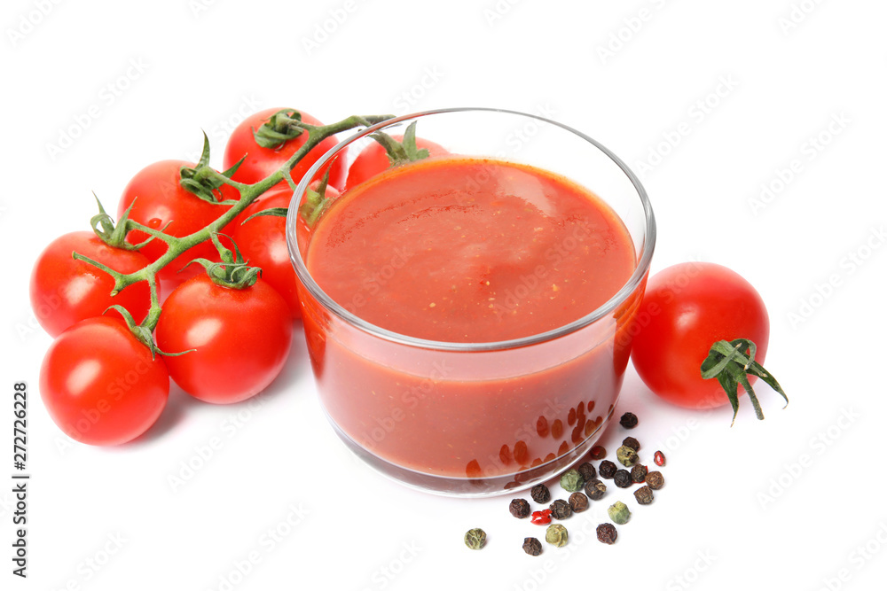Glass of sauce, tomatoes and pepper isolated on white Glass of sauce, tomatoes and pepper isolated on white