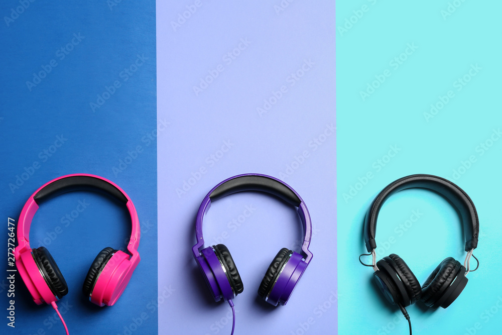 Stylish headphones on color background, flat lay. Space for text Stylish headphones on color background, flat lay. Space for text