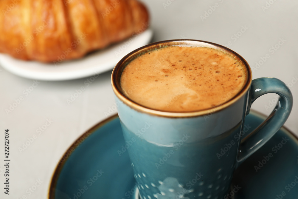 Cup of tasty aromatic coffee for breakfast on grey table, closeup Cup of tasty aromatic coffee for breakfast on grey table, closeup