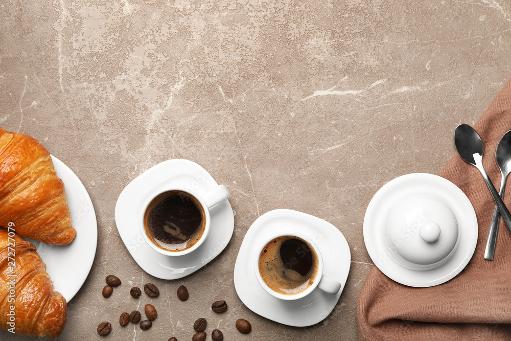 Flat lay composition with cups of coffee and croissants on grey background. Space for text - obrazy, fototapety, plakaty 