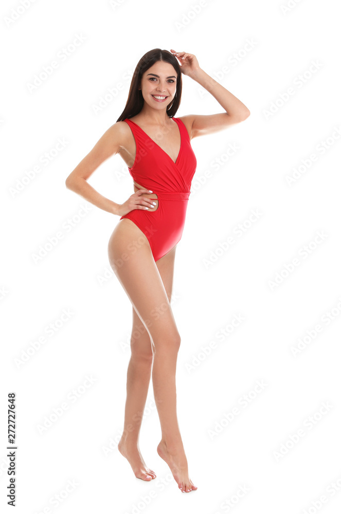 Full length portrait of attractive young woman with slim body in swimwear on white background