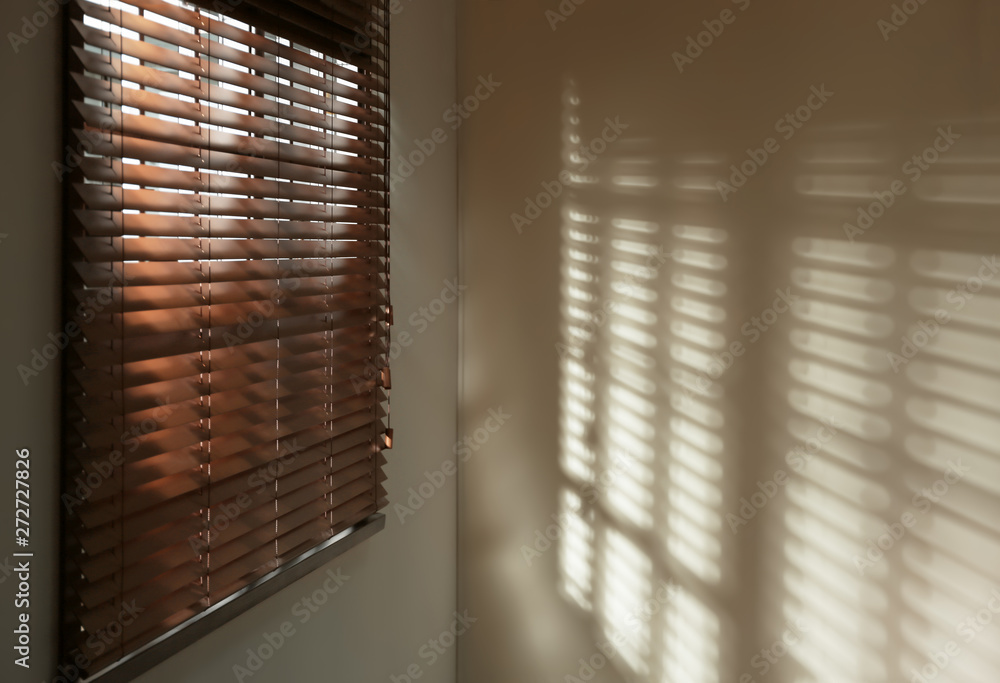 Window with horizontal blinds in room. Space for text Window with horizontal blinds in room. Space for text