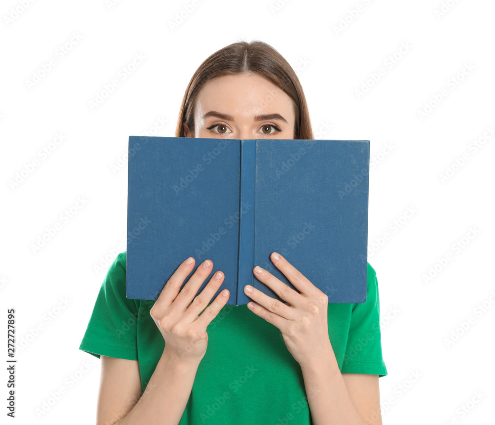 Young woman hiding behind book on white background. Reading activity Young woman hiding behind book on white background. Reading activity
