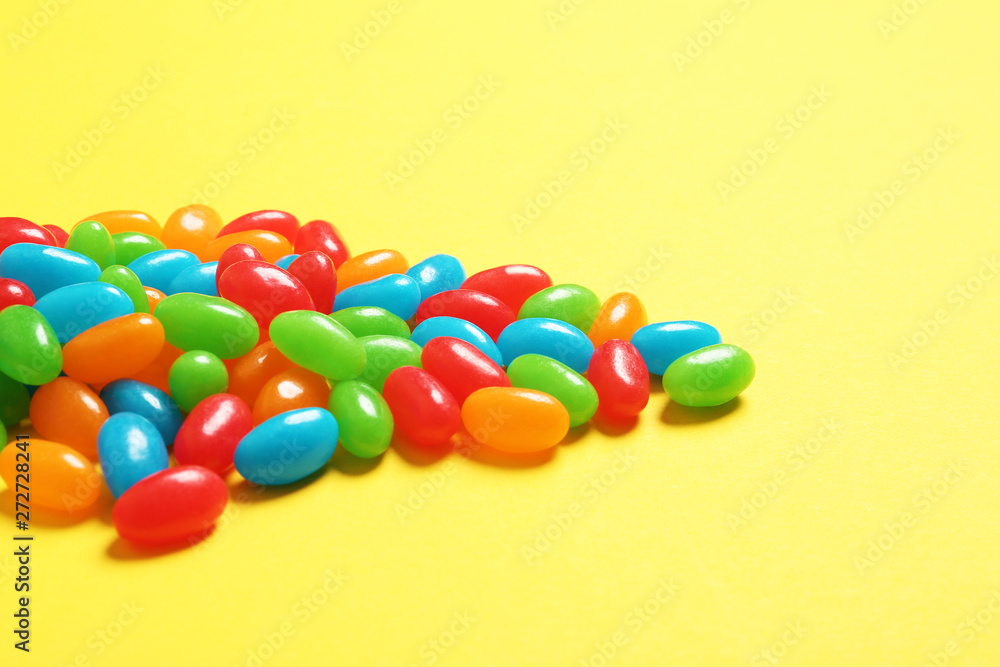 Delicious bright jelly beans on color background Delicious bright jelly beans on color background