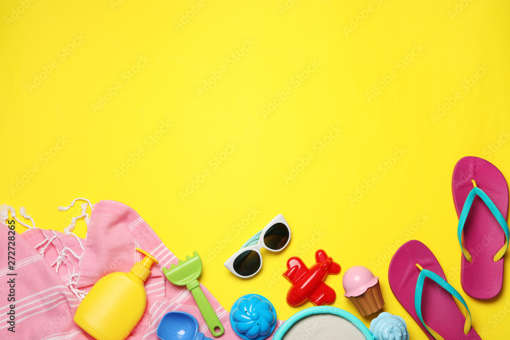 Flat lay composition with beach toys on color background. Space for text Flat lay composition with beach toys on color background. Space for text