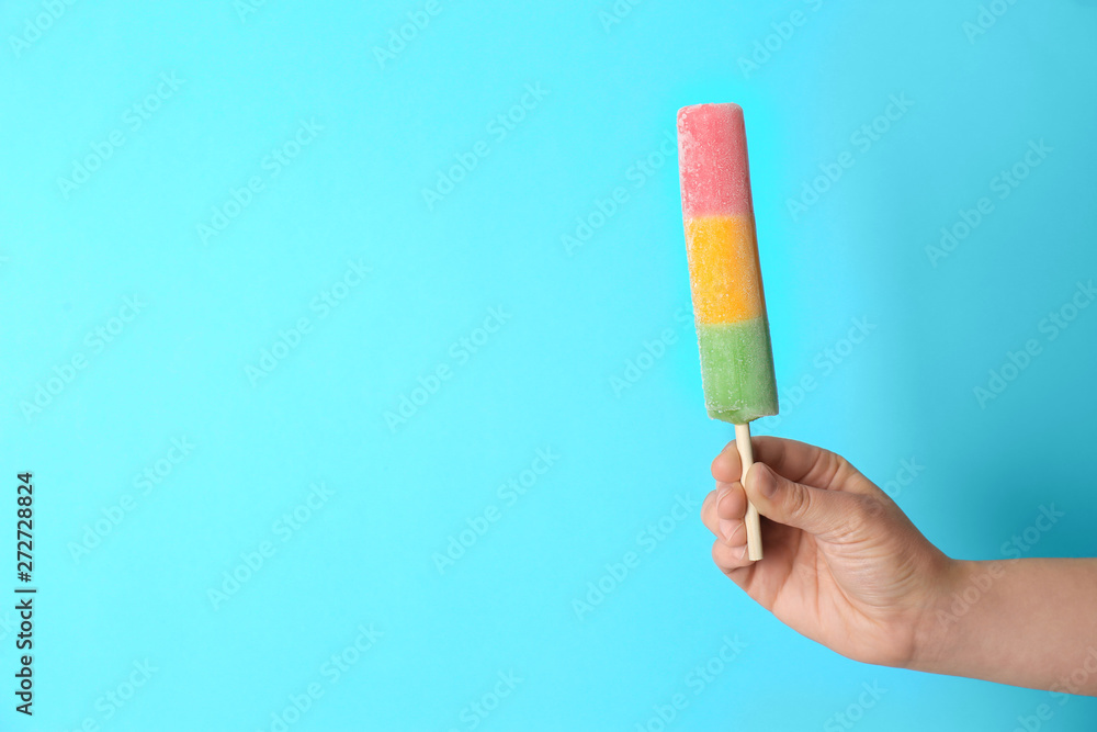 Woman holding delicious ice cream against color background, space for text Woman holding delicious ice cream against color background, space for text