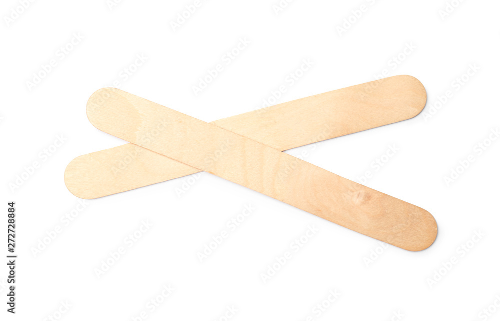 Empty wooden ice cream sticks on white background, top view Empty wooden ice cream sticks on white background, top view