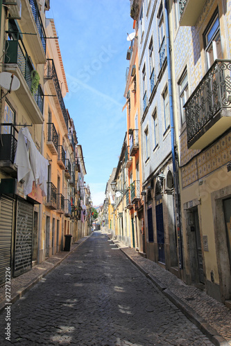 narrow alley in the historic bairro alto (old town) in lisbon, portugal © Luciernaga