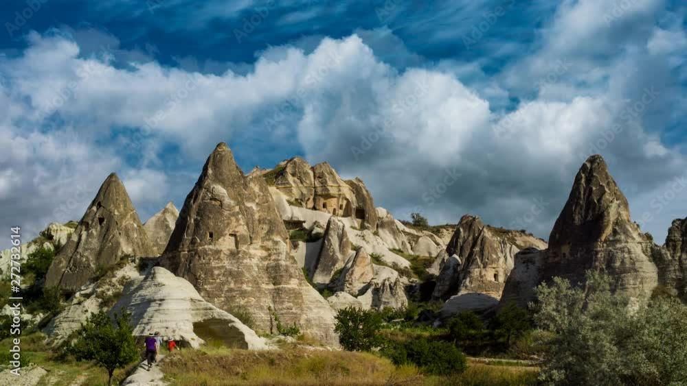 Cinemagraph of hikers frozen as scene zooms in and sky time lapse. Cinemagraph of hikers frozen as scene zooms in and sky time lapse.