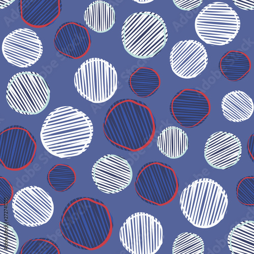 Scribble polka dots seamless pattern in blue, white and red. Fun, energetic irregular dot design, great for party decorations, paper goods, textiles, fashion and product packaging. Vector repeat tile.