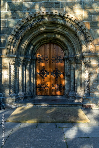 The Backgrounds of vintage door of Saint Mary   s Church and shading from the tree. Bergen  Norway