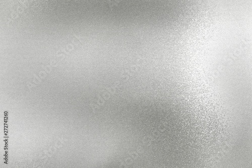 Glowing silver foil metal wall surface, abstract texture background