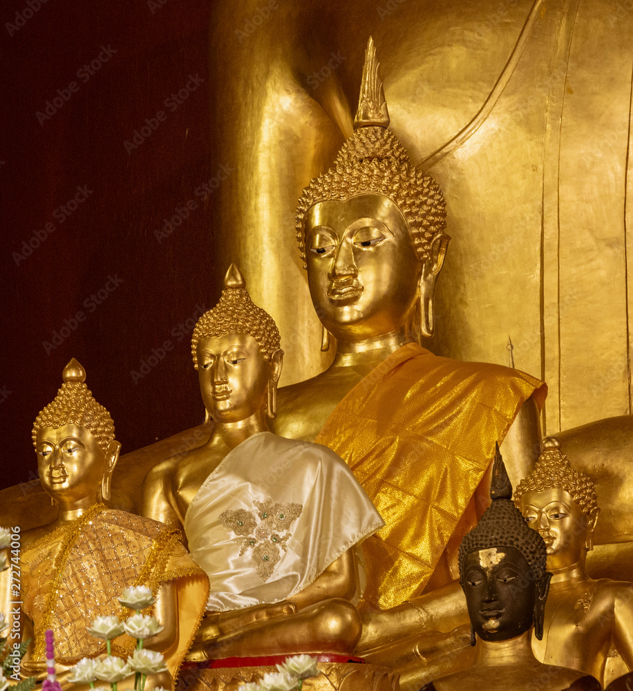 Golden Buddha Statues in Various Poses.
