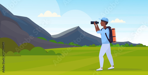 tourist hiker with backpack looking through binoculars hiking concept african american traveler on hike beautiful mountains nature landscape background full length flat horizontal vector illustration