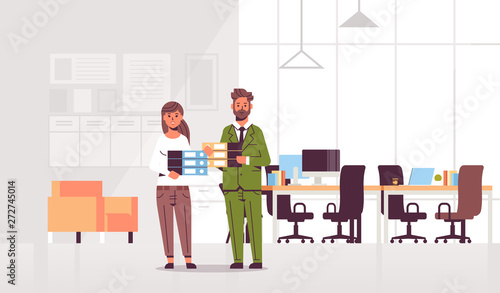overworked businesspeople man woman holding folder stack couple overloaded coworkers standing together paperwork hard working concept modern office interior flat full length horizontal